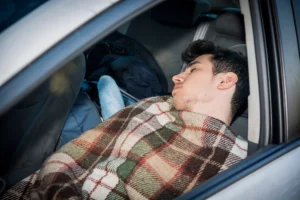 Man asleep in parked car