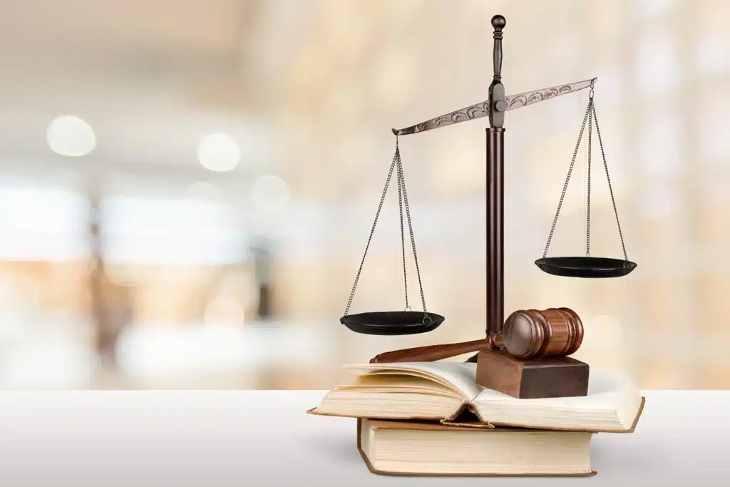 Scales and gavel on to p of legal books