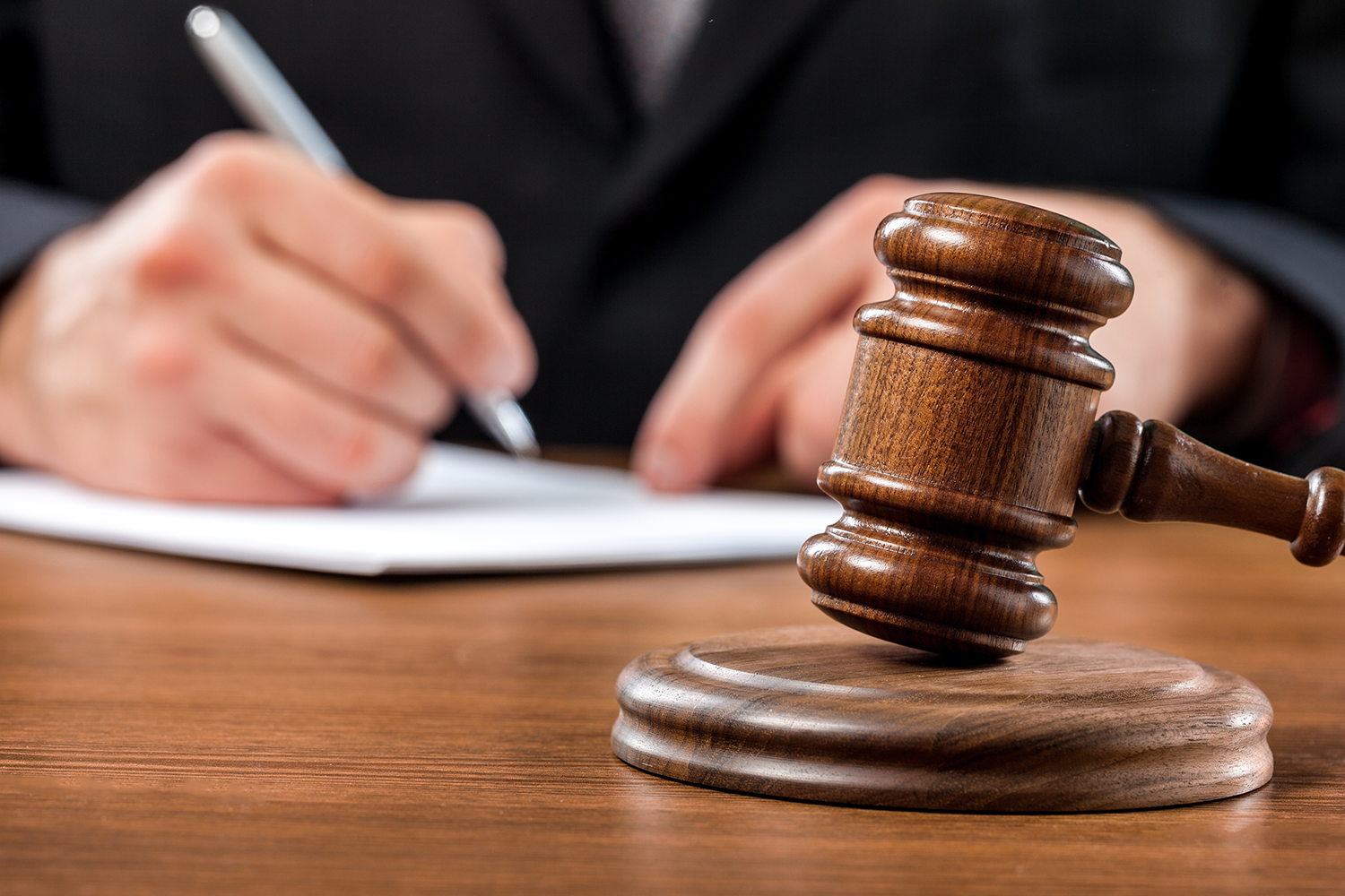 Close up of judge reviewing legal motions